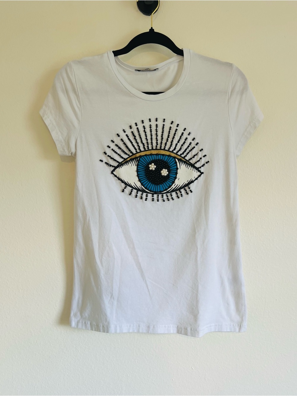 White Eye Graphic Tee with Blue & Gold Embellished Eye